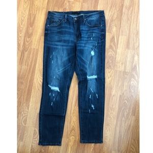 Brand new dark blue distressed denim jeans